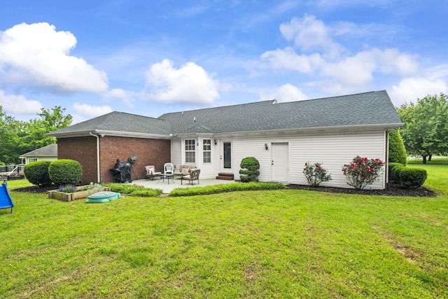 103 Nashay Ct, Portland, TN 37148 - rear view of property featuring a patio, a lawn, roof with shingles, and entry steps