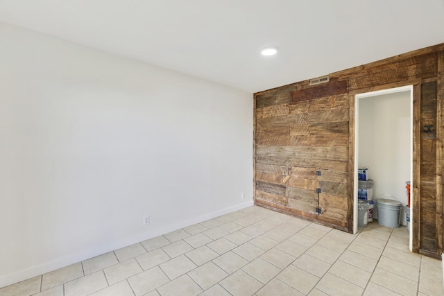unfurnished room featuring light tile patterned floors and recessed lighting