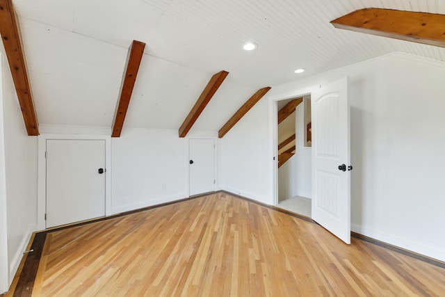 bonus room with light wood-style floors and recessed lighting