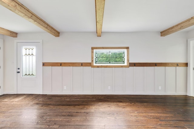 unfurnished room with beam ceiling and hardwood / wood-style flooring