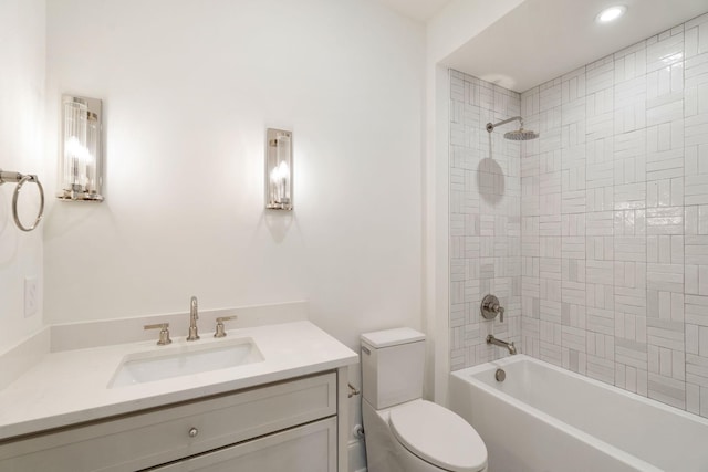 full bath featuring toilet, vanity, and bathtub / shower combination