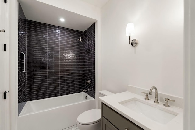 bathroom featuring toilet, bathtub / shower combination, and vanity