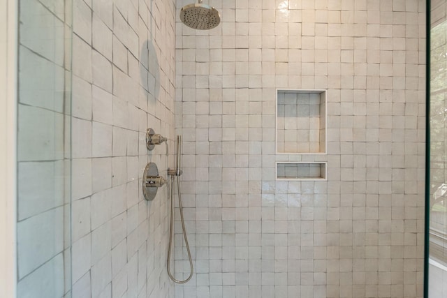 bathroom with a tile shower