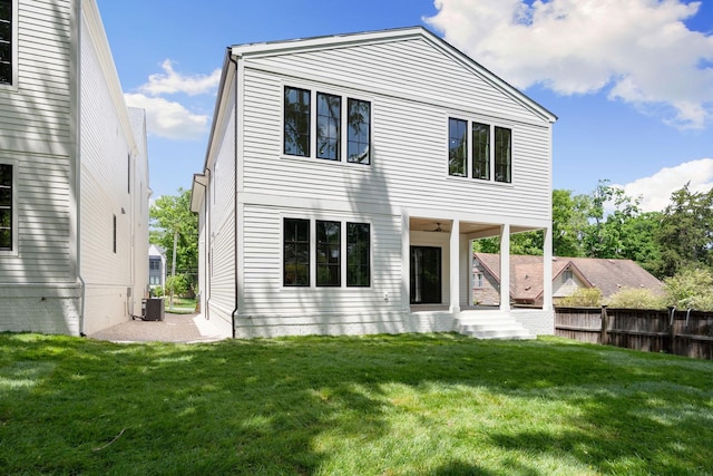 rear view of house with central AC unit