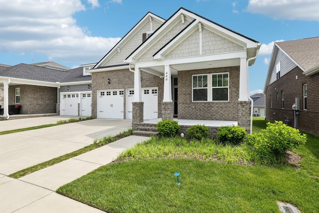 440 Golden Meadow Ln, Hendersonville, TN 37075 - craftsman-style house with brick siding, concrete driveway, a porch, and a garage