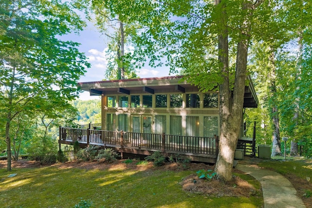698 Crestview Dr, Sparta, TN 38583 - back of property with a deck and a lawn