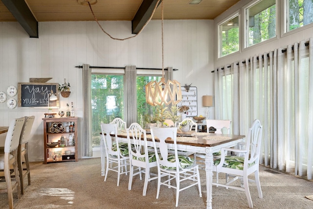 698 Crestview Dr, Sparta, TN 38583 - carpeted dining space with wooden ceiling with exposed beams and wooden walls