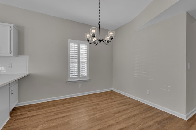 2732 Linmar Ave, Nashville, TN 37215 - unfurnished dining area with light wood-style floors, a chandelier, and baseboards
