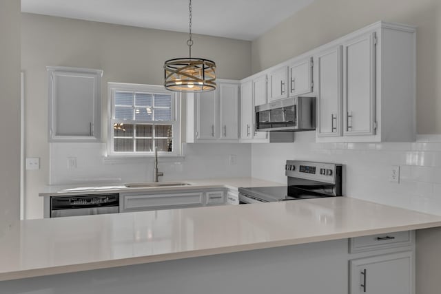2732 Linmar Ave, Nashville, TN 37215 - kitchen featuring stainless steel appliances, a sink, a chandelier, and decorative backsplash