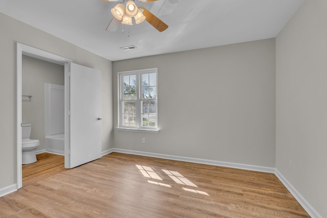2732 Linmar Ave, Nashville, TN 37215 - unfurnished bedroom featuring light wood-style floors, baseboards, connected bathroom, and ceiling fan