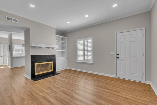 2732 Linmar Ave, Nashville, TN 37215 - unfurnished living room featuring light wood-type flooring, ornamental molding, a premium fireplace, baseboards, and recessed lighting