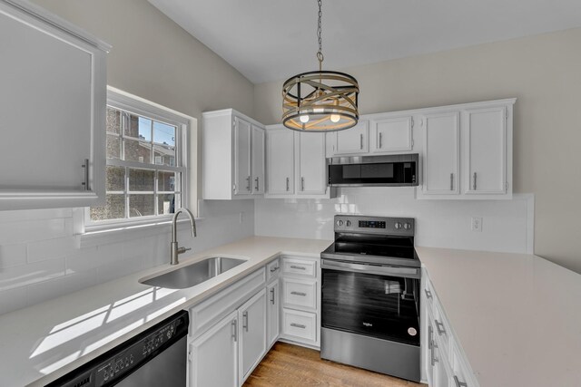 2732 Linmar Ave, Nashville, TN 37215 - kitchen featuring stainless steel appliances, a sink, light countertops, backsplash, and white cabinets