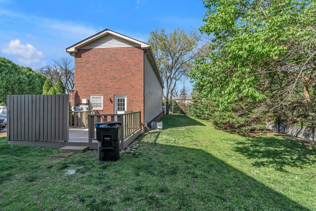 2732 Linmar Ave, Nashville, TN 37215 - view of side of home featuring brick siding, a wooden deck, a lawn, and central air condition unit