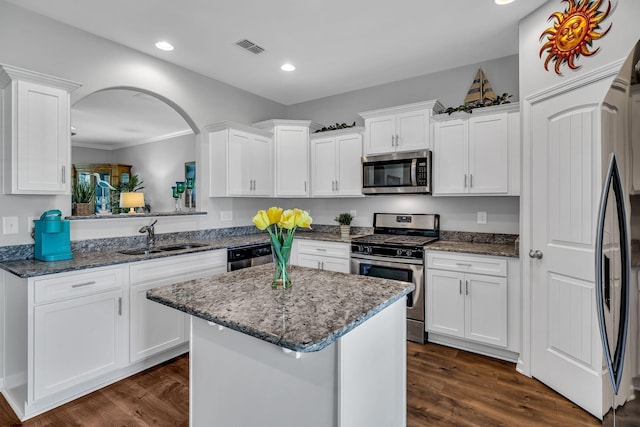 400 Tonalist Way, Smyrna, TN 37167 - kitchen featuring stainless steel appliances, a sink, white cabinets, a center island, and dark stone countertops