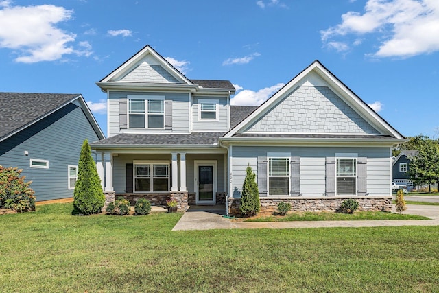 400 Tonalist Way, Smyrna, TN 37167 - craftsman inspired home featuring a front lawn, stone siding, covered porch, and a shingled roof