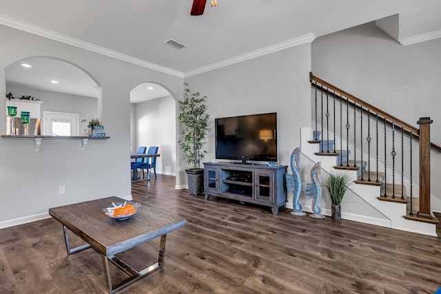 400 Tonalist Way, Smyrna, TN 37167 - living room with arched walkways, crown molding, baseboards, wood finished floors, and stairs