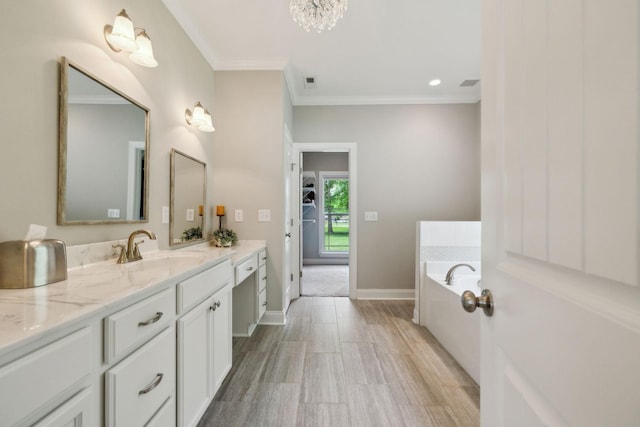 905 W Sagefield Dr, Smyrna, TN 37167 - full bathroom with crown molding, vanity, a garden tub, wood finished floors, and baseboards
