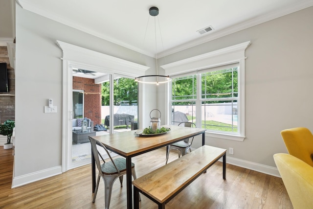 905 W Sagefield Dr, Smyrna, TN 37167 - dining space with baseboards, light wood-style floors, and ornamental molding