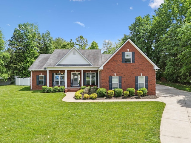 905 W Sagefield Dr, Smyrna, TN 37167 - view of front facade featuring brick siding, covered porch, and driveway