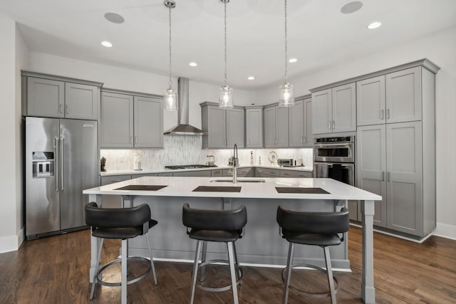 1211A Sigler St, Nashville, TN 37203 - kitchen with stainless steel appliances, wall chimney exhaust hood, gray cabinets, a sink, and recessed lighting