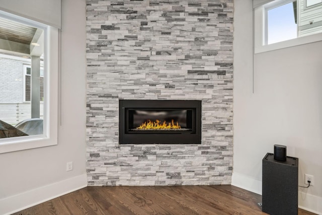 1211A Sigler St, Nashville, TN 37203 - detailed view of wood finished floors, baseboards, and a fireplace