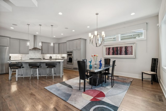 1211A Sigler St, Nashville, TN 37203 - dining space featuring recessed lighting, dark wood-style flooring, a chandelier, and baseboards