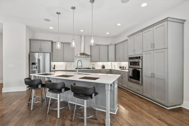 1211A Sigler St, Nashville, TN 37203 - kitchen featuring gray cabinets, wall chimney range hood, stainless steel appliances, and recessed lighting