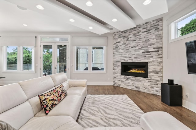 1211A Sigler St, Nashville, TN 37203 - living room featuring a tiled fireplace, wood finished floors, recessed lighting, french doors, and baseboards