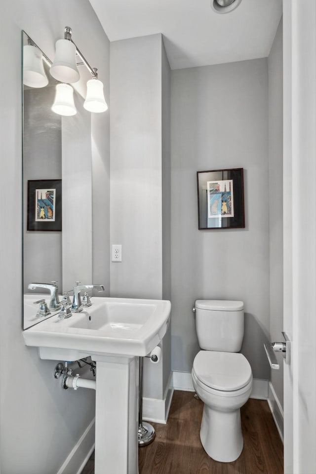 1211A Sigler St, Nashville, TN 37203 - bathroom featuring baseboards, wood finished floors, and toilet