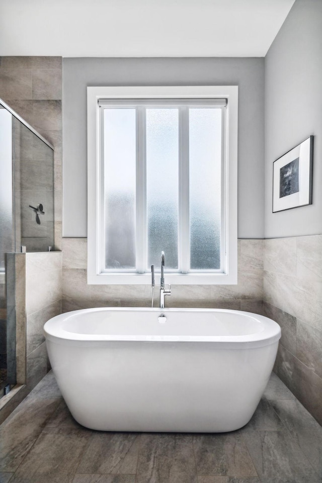 1211A Sigler St, Nashville, TN 37203 - full bath with tile walls, a stall shower, a freestanding tub, and wainscoting