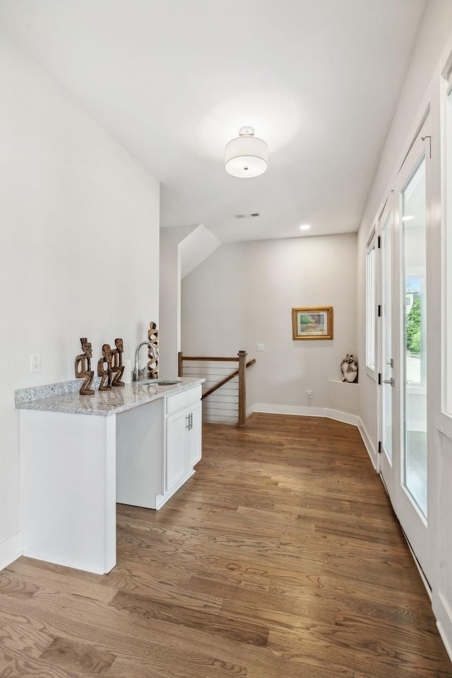1211A Sigler St, Nashville, TN 37203 - spare room featuring a sink, wood finished floors, and baseboards