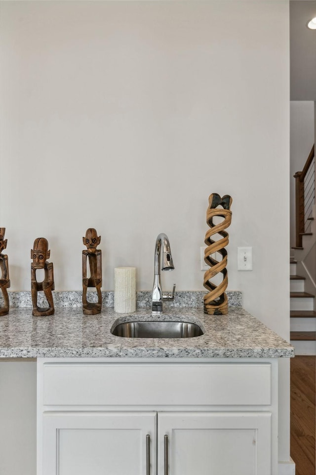 1211A Sigler St, Nashville, TN 37203 - bar featuring a sink, stairs, and wood finished floors