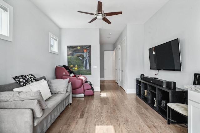 1211A Sigler St, Nashville, TN 37203 - living area featuring wood finished floors, a ceiling fan, and baseboards