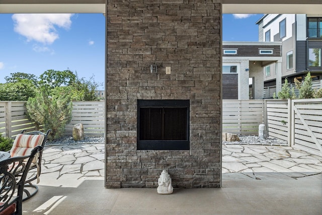 1211A Sigler St, Nashville, TN 37203 - view of patio featuring an outdoor stone fireplace and a fenced backyard