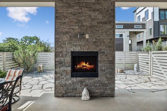 1211A Sigler St, Nashville, TN 37203 - view of patio featuring an outdoor stone fireplace and a fenced backyard