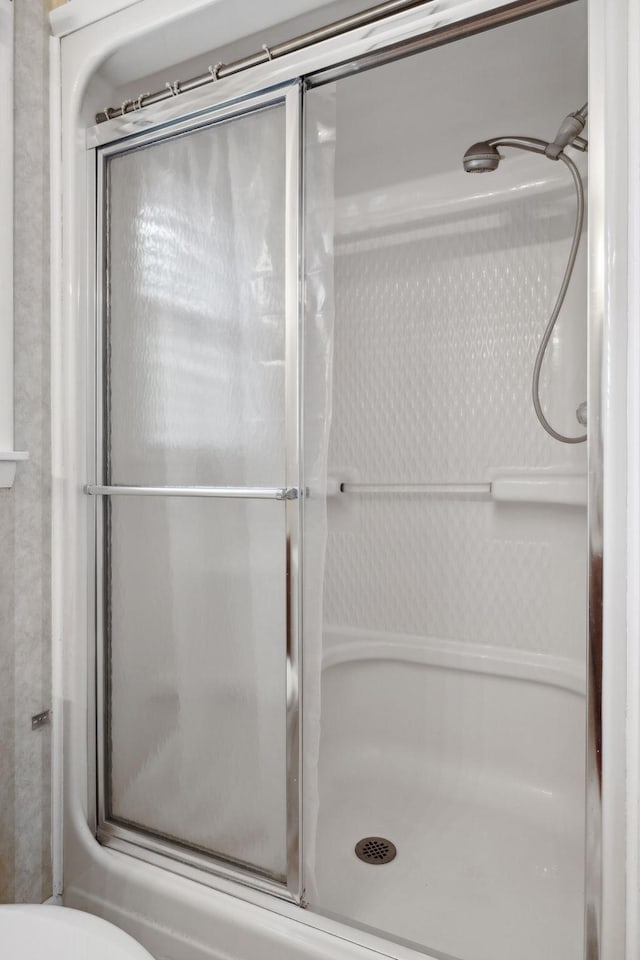 bathroom with a stall shower