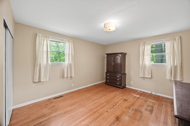 103 Walnut Dr, Carthage, TN 37030 - unfurnished bedroom featuring light wood-style floors, multiple windows, baseboards, and a closet