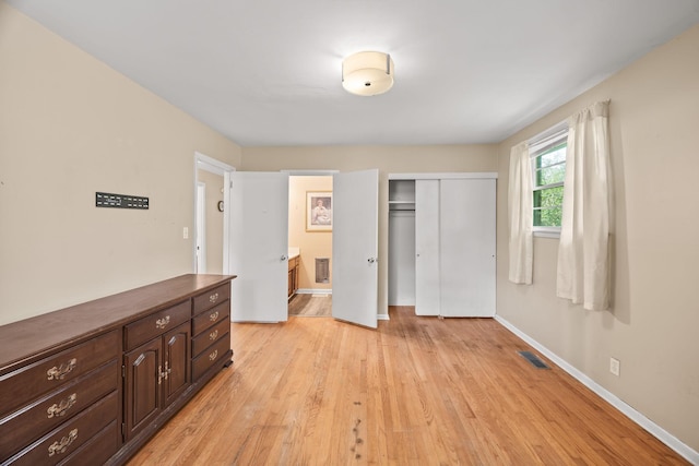 103 Walnut Dr, Carthage, TN 37030 - unfurnished bedroom featuring a closet, light wood finished floors, baseboards, and ensuite bathroom
