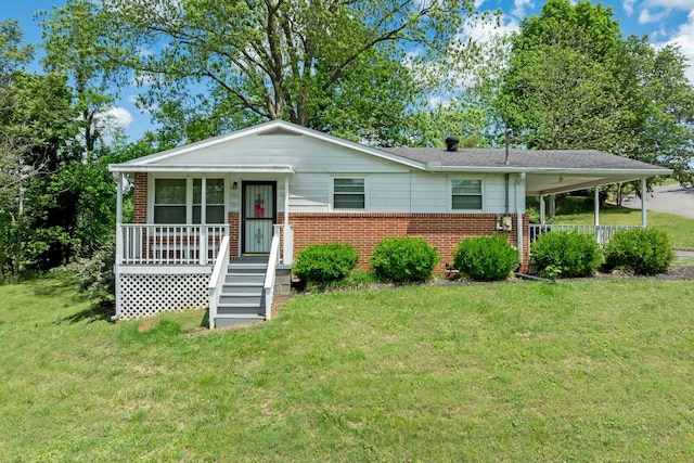 103 Walnut Dr, Carthage, TN 37030 - view of front facade featuring a porch, brick siding, and a front lawn