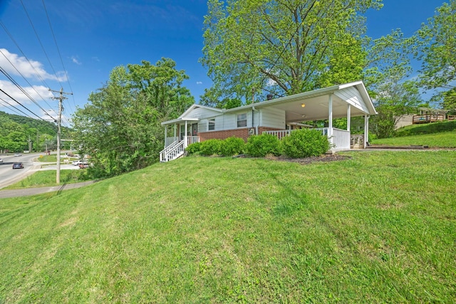 103 Walnut Dr, Carthage, TN 37030 - view of side of property with brick siding, a yard, and covered porch