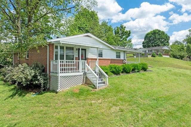 103 Walnut Dr, Carthage, TN 37030 - view of front of house featuring brick siding, a front lawn, and covered porch