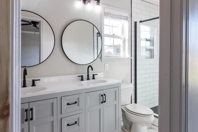 7919 Natahna Ct, Murfreesboro, TN 37127 - bathroom with toilet, ceiling fan, a stall shower, and double vanity