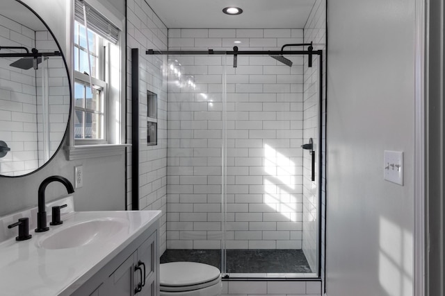 7919 Natahna Ct, Murfreesboro, TN 37127 - bathroom featuring a stall shower, toilet, vanity, and healthy amount of natural light
