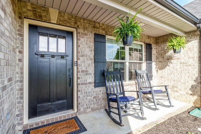 7919 Natahna Ct, Murfreesboro, TN 37127 - view of exterior entry featuring brick siding and covered porch