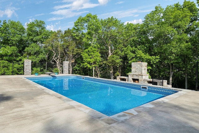 150 Valley Vista Dr, Carthage, TN 37030 - view of pool with a patio area, an outdoor stone fireplace, and view of wooded area