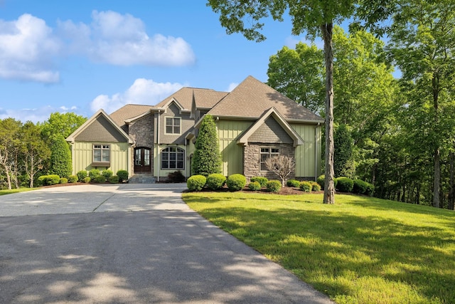 150 Valley Vista Dr, Carthage, TN 37030 - craftsman-style home with board and batten siding, stone siding, and a front lawn