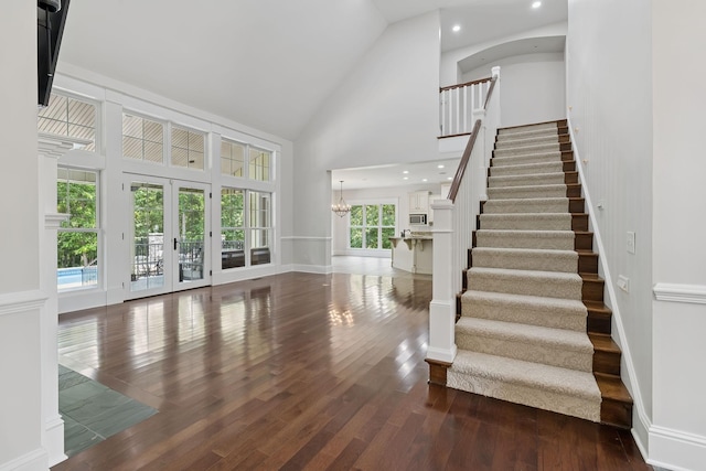 150 Valley Vista Dr, Carthage, TN 37030 - stairs featuring high vaulted ceiling, wood finished floors, baseboards, french doors, and a chandelier