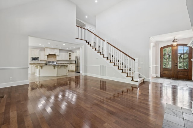 150 Valley Vista Dr, Carthage, TN 37030 - entrance foyer featuring a high ceiling, wood finished floors, baseboards, stairs, and french doors