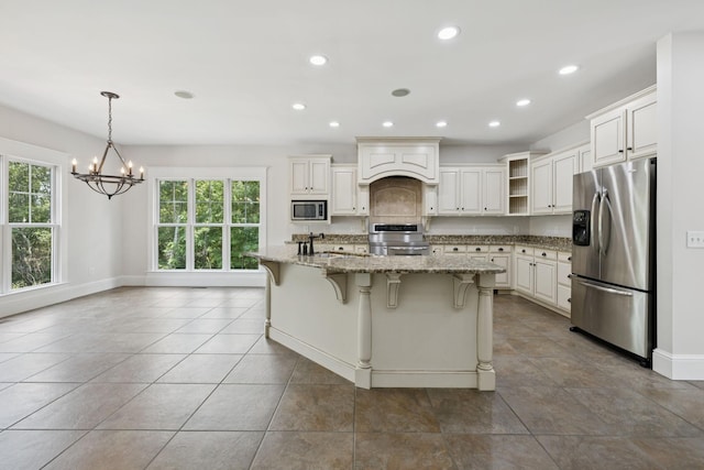 150 Valley Vista Dr, Carthage, TN 37030 - kitchen featuring appliances with stainless steel finishes, a chandelier, open shelves, light stone counters, and recessed lighting