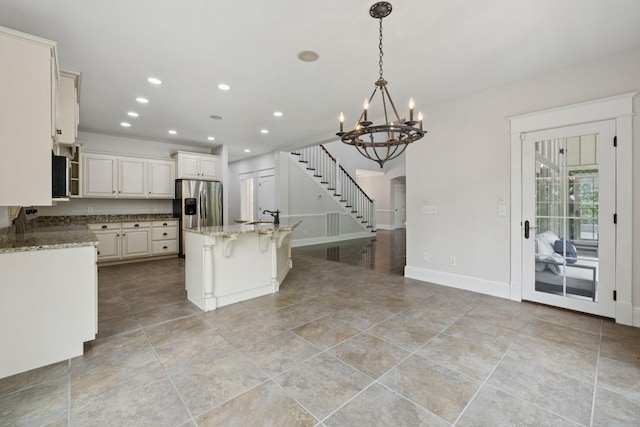150 Valley Vista Dr, Carthage, TN 37030 - kitchen with appliances with stainless steel finishes, a chandelier, a sink, stone countertops, and recessed lighting